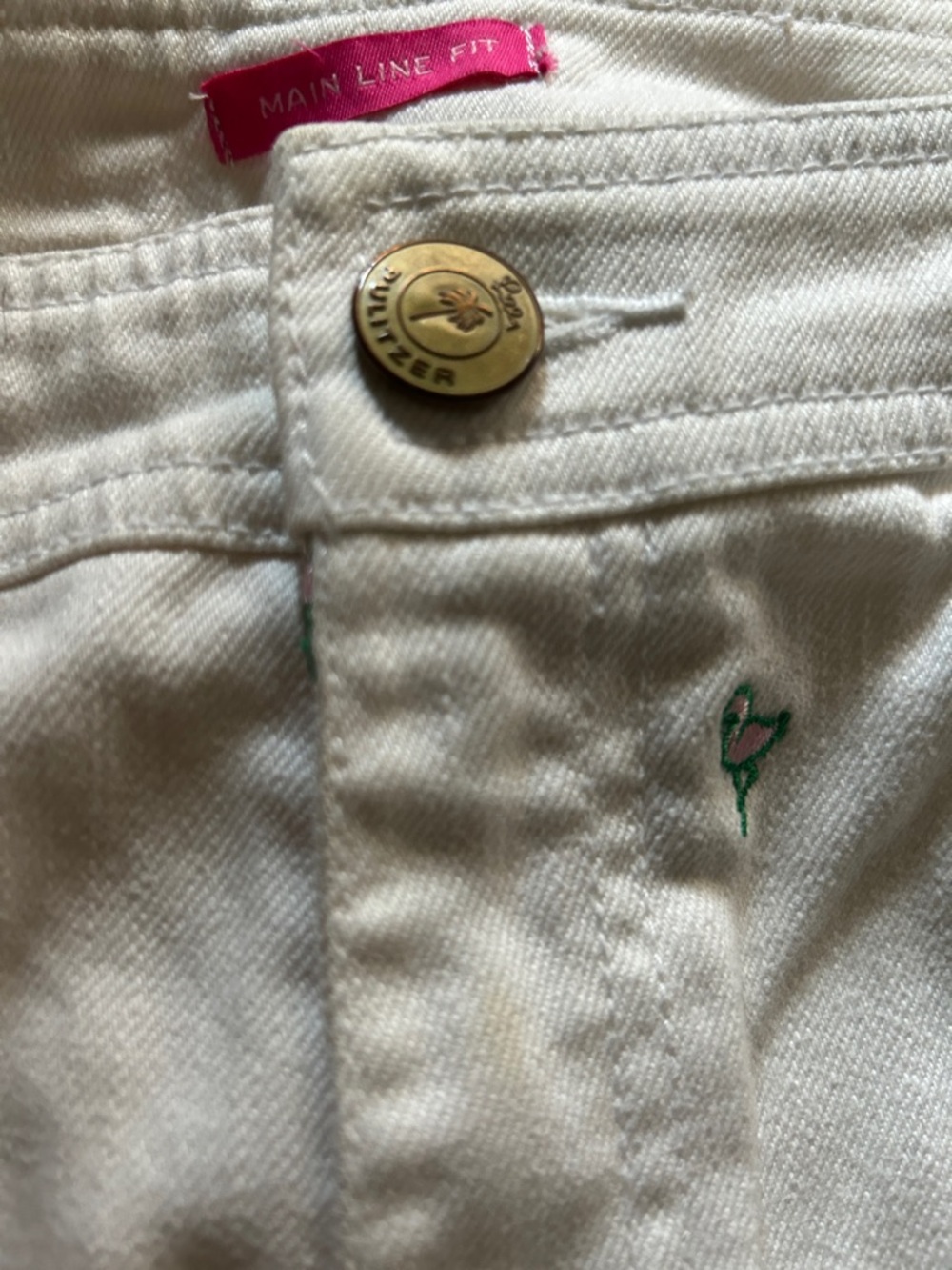 Embroidered Pink Flamingo Pocket Detail on Cream Fabric. Lilly Pulitzer